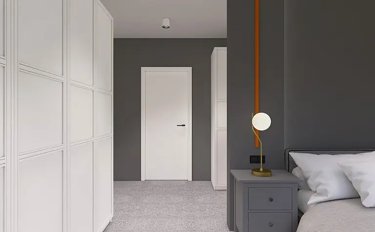 Garderoba w minimalistycznym stylu z białymi meblami i szarymi akcentami