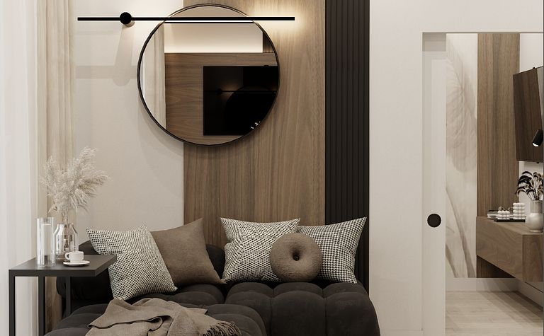 Stylowy salon z czarną sofą, drewnianą ścianą i nowoczesnym oświetleniem.