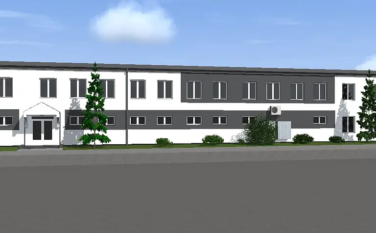 Widok zewnętrzny na budynek z białą i szaro-czarną elewacją, styl industrialny i nowoczesny.