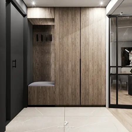 Przedpokój w stylu industrialnym z drewnianą zabudową, minimalistycznymi akcentami i nowoczesnym oświetleniem.