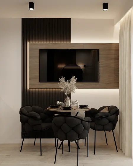 Jadalnia z nowoczesnym okrągłym stołem i czarnymi krzesłami, drewniane akcenty
