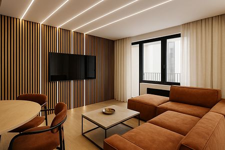 Wnętrze salonu w stylu industrialnym z brązową sofą i drewnianymi elementami.
