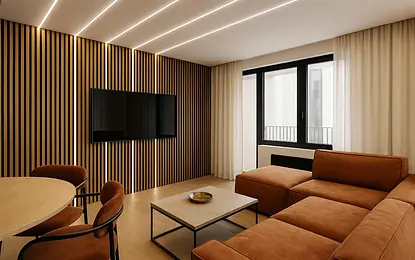 Wnętrze salonu w stylu industrialnym z brązową sofą i drewnianymi elementami.