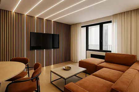 Wnętrze salonu w stylu industrialnym z brązową sofą i drewnianymi elementami.