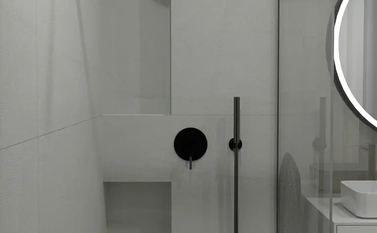 Nowoczesna łazienka z minimalistycznym prysznicem i białymi meblami.