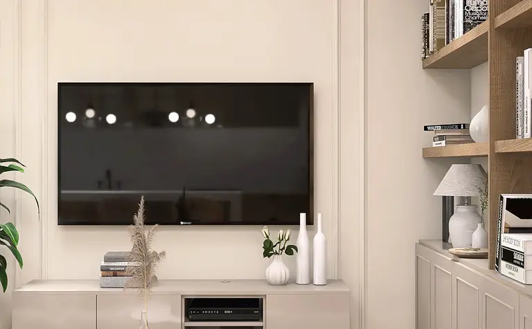 Salon z telewizorem, minimalistycznymi meblami i półkami na książki w stylu nowoczesnym.