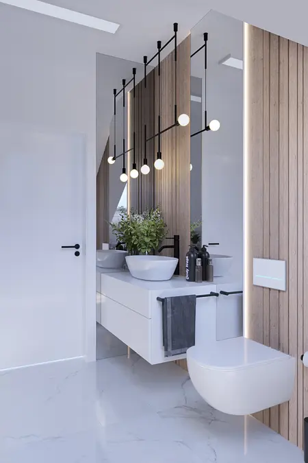 Wnętrze łazienki z białymi umywalkami, drewnianymi detalami i nowoczesnym oświetleniem